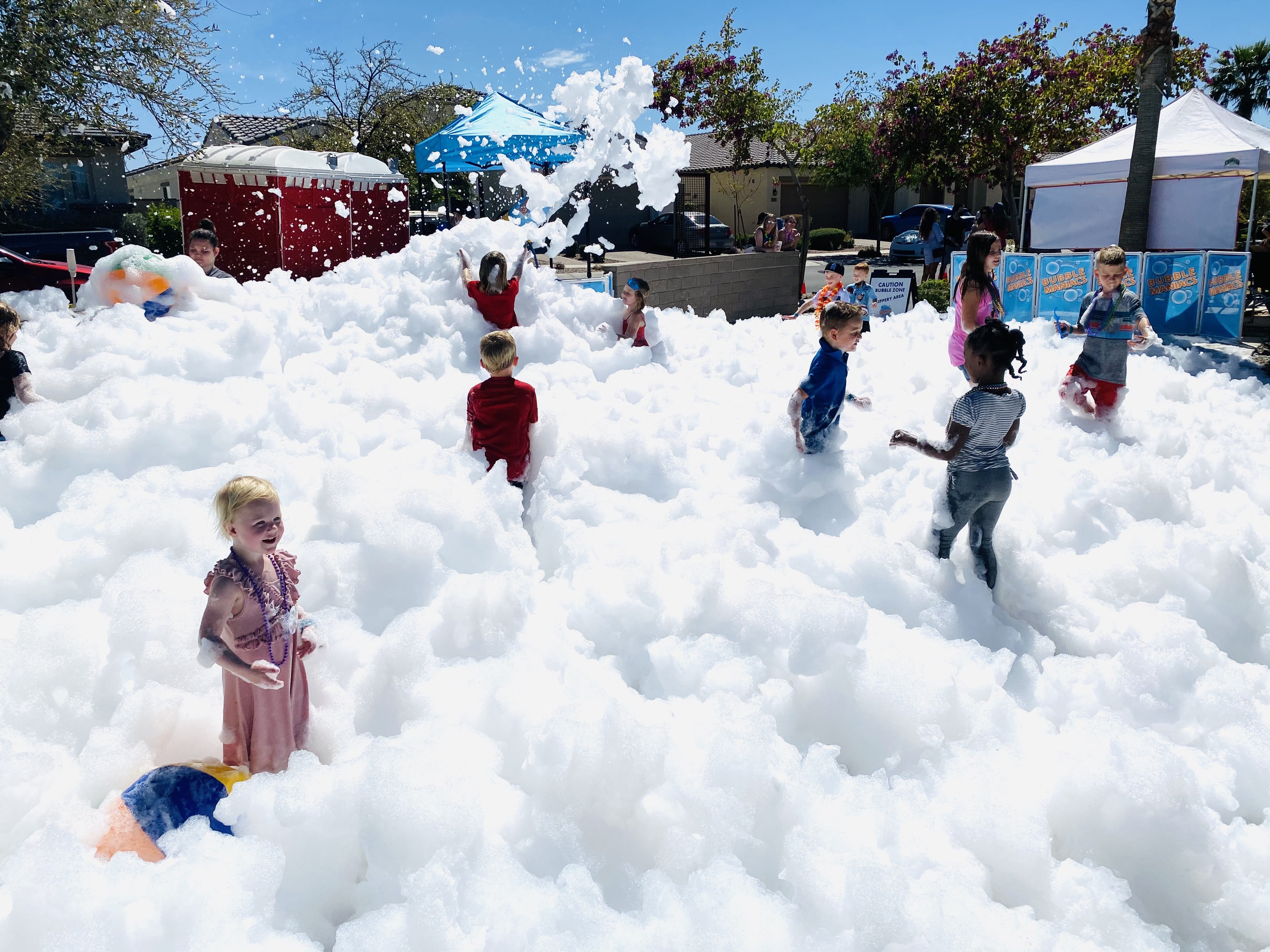 kids playing in foam bubbles