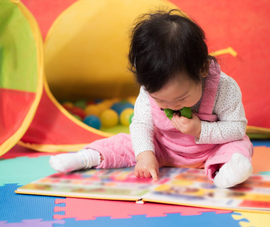 baby looking at a book